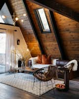 Living, Sofa, Chair, Coffee Tables, End Tables, Ceiling, Pendant, and Dark Hardwood  Living Pendant Chair Ceiling Dark Hardwood Photos from Big Bear A-Frame Receives Boho Eclectic Transformation