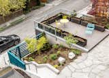 Multiple decks and new landscaping transform the outdoor space into an urban oasis.