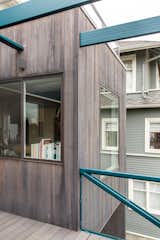 The addition includes new windows, multiple decks and a contrast of gray tones and blues. 