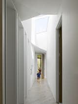Hallway and Light Hardwood Floor  Photo 8 of 10 in Parallelogram House by 5468796 Architecture