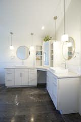 the vanities offer plenty of storage and the make-up area with mirrored cabs even more functionality
