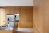 Kitchen, Metal Counter, Light Hardwood Floor, Refrigerator, Wood Cabinet, Laminate Cabinet, and Wall Oven Kitchen  Photo 8 of 17 in La Magnolia by MARTIN GOMEZ