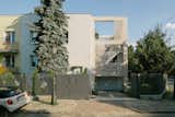 House for W / exterior / brick facade / steel / external staircase / terrace 