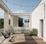 House for W / exterior / brick facade / steel / external staircase / terrace / wooden deck