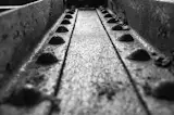 About This Black and White Photo:

Rivets in Steel Girder is a black and white photograph of the leading lines and pattern of the rivets in the rusting steel girder of an abandoned building.

Title: Rivets in Steel Girder
Photographer: Melissa Fague
Genre: Abstract Photography
Item ID#: ABS-6007

This still life / abstract photograph is one of many available for purchase through www.pipafineart.com. You have your chose of size and print materials. All of our still life / abstract  pictures are printed on high quality materials and the highest quality ink for longevity. Each photo print is also coated with a soft luster finish. If you need assistance we are always available; please contact us with any questions.