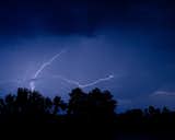 Lightning in the valley is a night photograph that was created in the valley of north Wilmington during a lightning storm. With the absence of man made lights and the thin bolts that night allowed the trees to silhouette as the sky lit up.

Title: Lightning over the Valley
Landscape Photographer: Melissa Fague
Genre: Night Nature Photography
Item ID#: NGHT-7009

This night  photograph is one of many available for purchase through www.pipafineart.com. You have your chose of size and print materials. All of our night time  pictures are printed on high quality materials and the highest quality ink for longevity. Each photo print is also coated with a soft luster finish. If you need assistance we are always available; please contact us with any questions.