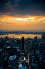 Sunset over NYC is a cityscape photograph of New-York City at sunset on a stormy evening. This photograph was taken off of the platform of the Empire State Building.

Title: Sunset over NYC
Landscape Photographer: Melissa Fague
Genre: Night Urban Landscape Photography
Item ID#: NGHT-7018

This night  photograph is one of many available for purchase through www.pipafineart.com. You have your chose of size and print materials. All of our night time  pictures are printed on high quality materials and the highest quality ink for longevity. Each photo print is also coated with a soft luster finish. If you need assistance we are always available; please contact us with any questions.