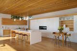 Kitchen, Refrigerator, Wall Oven, White Cabinet, Light Hardwood Floor, and Recessed Lighting  Photo 8 of 11 in Tiburon Home by Jayme Catalano