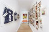 This hallway, leading to the kid's rooms, gave the perfect place for the family to showcase family photos.