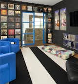 This custom designed wall display of the client's most favorite vinyl's gives each cubby its own stip of LED lights to wash the front of each sleeve to show off the art of each vinyl.