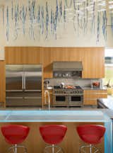 Kitchen, Refrigerator, Mosaic Tile Backsplashe, Range Hood, Recessed Lighting, Wall Oven, Microwave, Ice Maker, Undermount Sink, Dishwasher, Porcelain Tile Floor, Accent Lighting, Wood Cabinet, Engineered Quartz Counter, and Range  Photo 2 of 52 in Modern Frontier by Mary Anne Smiley