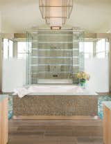 Bath Room, Recessed Lighting, Vessel Sink, Freestanding Tub, Two Piece Toilet, Ceiling Lighting, Accent Lighting, Porcelain Tile Floor, Glass Tile Wall, Open Shower, Engineered Quartz Counter, Pendant Lighting, and Undermount Tub  Photo 15 of 52 in Modern Frontier by Mary Anne Smiley