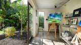 Detached private art studio with garden views made from a shipping container. 
