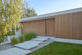 Exterior, Wood Siding Material, Flat RoofLine, Concrete Siding Material, Green Siding Material, Stucco Siding Material, and House Building Type K-house.  Entrance  Photo 8 of 21 in K-House by STOPROCENT Architekci