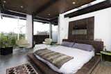 Bedroom and Bed  Photo 20 of 20 in Midcentury Modern Home with Industrial Loft Influence & Ocean Views by KASE REAL ESTATE