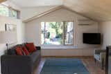 The living room flows right from the kitchen/dining area in this open plan