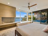 Primary suite opens out onto the back patio and includes views of Lake Travis