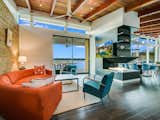 The living space also includes a stone accent wall and a unique double sided fireplace