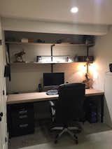 Mans cave office. Everything is hidden in a big storage closet, paper, documents and printer. 