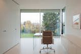 Office, Shelves, Desk, Chair, and Limestone Floor  Photo 11 of 13 in House P+G by Architekten Wannenmacher + Möller 