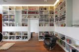 Office, Library Room Type, Bookcase, Storage, Shelves, Lamps, Medium Hardwood Floor, Desk, and Chair  Photo 8 of 8 in Penthouse Apartment in Bielefeld by Architekten Wannenmacher + Möller 