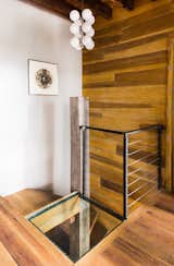 Spiral stair to basement. Glass floor provides natural light