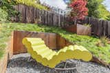 The 2 Corten Steel cubs create useful space in the sloped garden