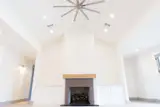 Thirteen foot vaulted ceilings with shiplap fireplace and built-in cabinetry complete the great room.