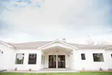 Dual French doors lead to backyard.