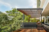 Outdoor, Metal Fences, Wall, Rooftop, Trees, Wood Patio, Porch, Deck, and Shrubs  Photos from Villa Jardín
