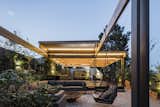 Outdoor, Rooftop, Garden, Concrete Patio, Porch, Deck, Landscape Lighting, Metal Patio, Porch, Deck, Trees, Wood Patio, Porch, Deck, Wood Fences, Wall, Gardens, and Shrubs  Photo 19 of 38 in La Janda by Johan Lemaitre from Terraza Francia