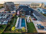 Drone shot of Salt Water Pool, native landscaping, clamshell parking and Lokal Hotel steps from the main Cape May beaches.