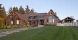 Remodel and refresh of a 1980's timber frame included new fenestration, siding, timber elements, and a pavilion with connecting trellis.