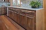 Site-harvested walnut found new life as the kitchen cabinetry within the Jewel. 