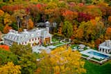 Traditional East Coast Estate - Dynamic stained wood windows and doors with traditional lead glass divisions.