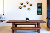 The ocean view dining area comfortably seats 8 at single slab table of indigenous wood.