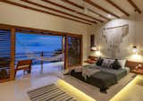 Like the rest of the villa, the master is adorned with clean modern lines with organic, local materials, and a simple, natural palette,  letting the views and nature take the lead.