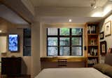 Bedroom, Bed, Chair, Dresser, Shelves, and Light Hardwood Floor  Photo 9 of 14 in Leong Fee Terrace by Cateline