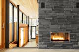 Interior palette: slate fireplace, Douglas fir ceilings, black accents, glass
