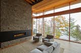 Living Room, Sectional, Standard Layout Fireplace, Gas Burning Fireplace, Light Hardwood Floor, Chair, Ribbon Fireplace, and Accent Lighting  Photo 11 of 17 in Severn Sound Cottage by Trevor McIvor Architect