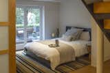 Sleeping area with movable obscure glass wall