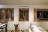 Wine storage , home theater and built in bench within alcove wall 