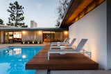 New cantilevered ipe wood sun deck over new pool.