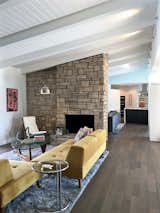 Living room with original fireplace.