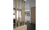 Living Room, Ceramic Tile Floor, Wall Lighting, Recessed Lighting, and Sofa detail of wooden partition between kitchen & dining  Photo 3 of 8 in Apartment refurbishment in Athens by design and structures