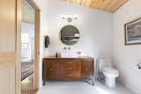Bath Room, Open Shower, One Piece Toilet, Vessel Sink, Wall Lighting, Wood Counter, and Ceramic Tile Floor Vintage furniture used as a bath vanities saved on the budget.  Photo 15 of 18 in Westwood House by Assembly Architecture & Build, PLLC