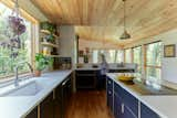 Kitchen, Cooktops, Engineered Quartz Counter, Laminate Cabinet, Medium Hardwood Floor, Undermount Sink, Pendant Lighting, and Wall Oven  Photo 6 of 14 in Merion House by Assembly Architecture & Build, PLLC