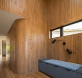 Entry hall, curved wall with hidden door to bathroom