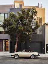 The all-black front facade has an industrial edge that flows with the industrial neighborhood. 
