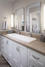 The vanity is custom by JT Designs. Hardware is sourced from Top Knobs. Medicine cabinets are from Restoration Hardware. Trough sink is from Pirch. 
